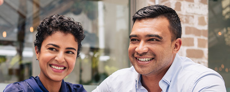 Smiling Couple at Cafe